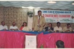 Ln AVK addressing a Lions Club event as Mrs. AVK looks on