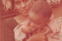 Mrs. Krishna Kumari holding a young Poorna Kumar